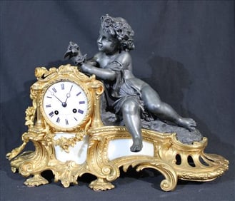 Napoleon III style gilt patinated bronze figural clock, 18 in. T.