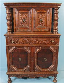 Jacobean style carved oak cupboard, 64 in. T, 42 in W, 17 in. D.