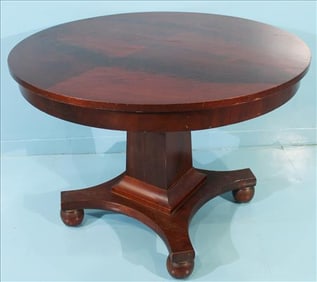 Empire mahogany center table with square base, 41 in. R, 30 in. T.