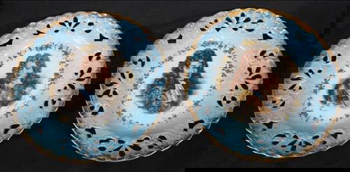 Pair of Hand-Painted Portrait Cabinet Plates with Reticulated Borders: Pair of 19th to early 20th century hand-painted porcelain cabinet plates, each featuring a detailed portrait of a courtly gentleman in elaborate attire and armor. The portraits are framed by delicate