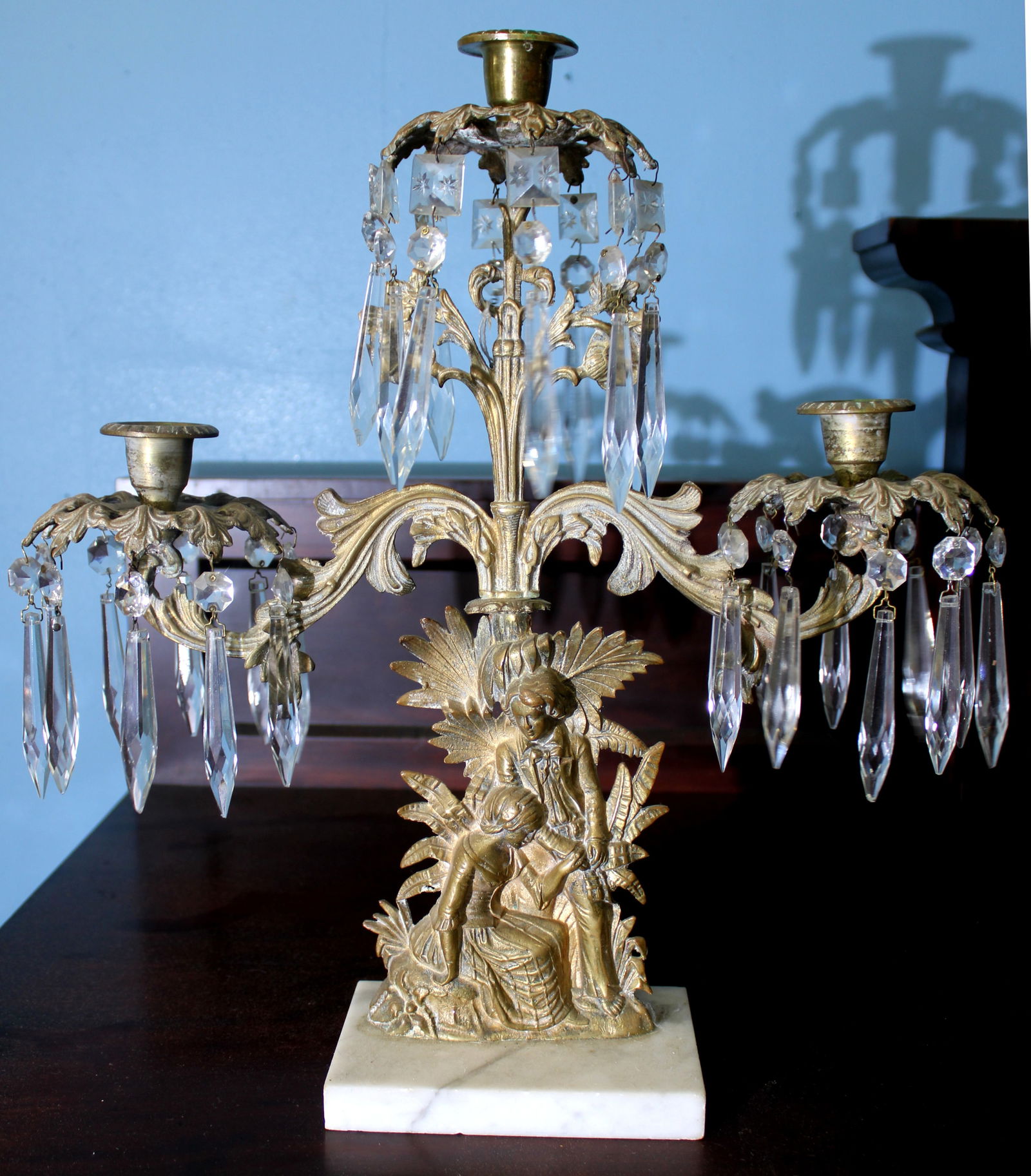 Single Victorian Gilt Girandole on Marble Base: Single Victorian girandole featuring a gilt metal figural base of a seated woman in flowing robes surrounded by palm fronds. Mounted on polished white marble base for contrast. A fine example of late