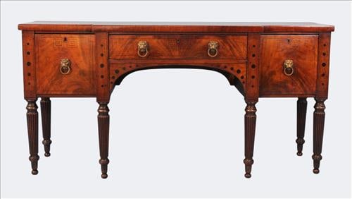 Federal Mahogany Sideboard/Server with Cellarette Drawer: American c. 1810-1825, a fine Federal period mahogany sideboard or server, the rectangular case fitted with three drawers across the frieze, raised on six reeded and turned legs. The case features bol