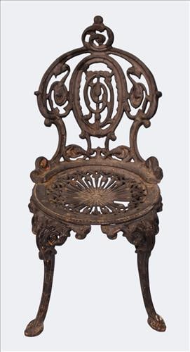 Victorian Style Case Iron Garden Chair: A Victorian style cast iron garden armchair. The back splat with scrolling foliate design centered by a pierced medallion, above a pierced seat and cabriole legs ending in pad feet. Retains old black 