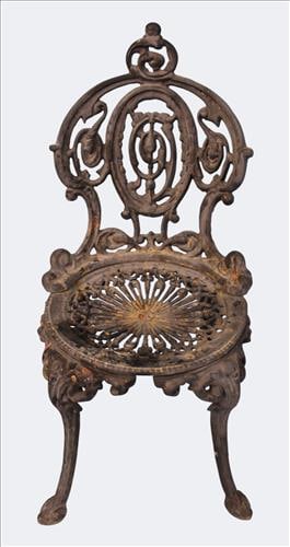 Victorian Style Case Iron Garden Chair: A Victorian style cast iron garden armchair. The back splat with scrolling foliate design centered by a pierced medallion, above a pierced seat and cabriole legs ending in pad feet. Retains old black 