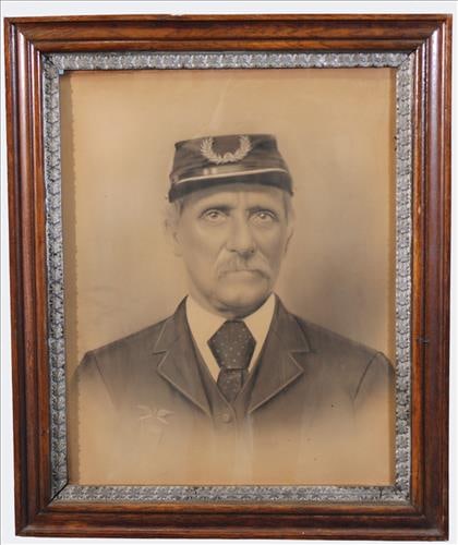 Early 20th Century Lithographic Portrait of Veteran: A sepia-toned lithographic portrait depicting an older gentleman in uniform, wearing a kepi-style cap with laurel wreath insignia and dressed in coat and tie. The sitter appears to be a veteran, possi