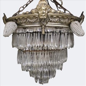 Neoclassical Bronze and Crystal Chandelier with Mask Mounts