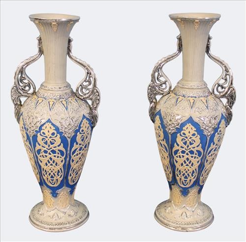 Pair of Royal Bonn Stoneware Vases: Elegant matched pair of Royal Bonn art pottery vases, late 19th early 20th century, each vase features a tall flaring neck and ornate twin handles with relief molded scrollwork, decorated in cobalt bl