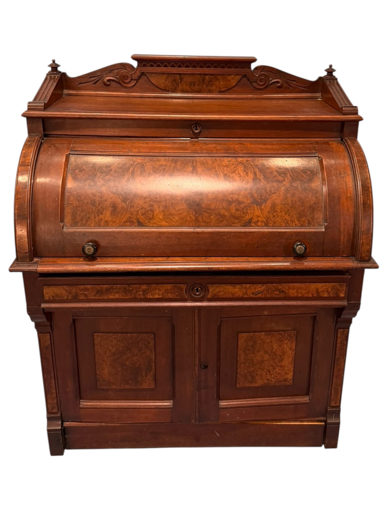Victorian Burl Walnut Lady’s Cylinder Secretary Desk, Circa 1880: A charming Victorian lady’s cylinder secretary desk in walnut and burl walnut veneer, circa 1880, designed in a graceful compact scale typical of parlor and bedroom use. The case features a richly f