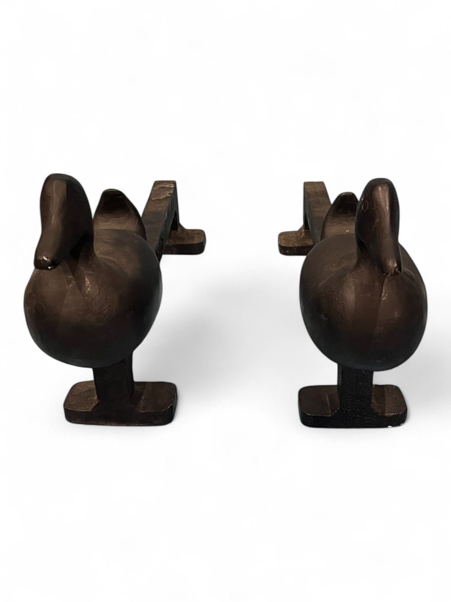 Pair of Cast Iron Duck-Form Andirons, Marked Four Seasons Shop, Memphis Tenn.: Charming pair of cast iron duck-form andirons by Four Seasons Shop, mid-20th century. Each andiron features a stylized duck with smooth sculptural contours, mounted on horizontal log supports impresse