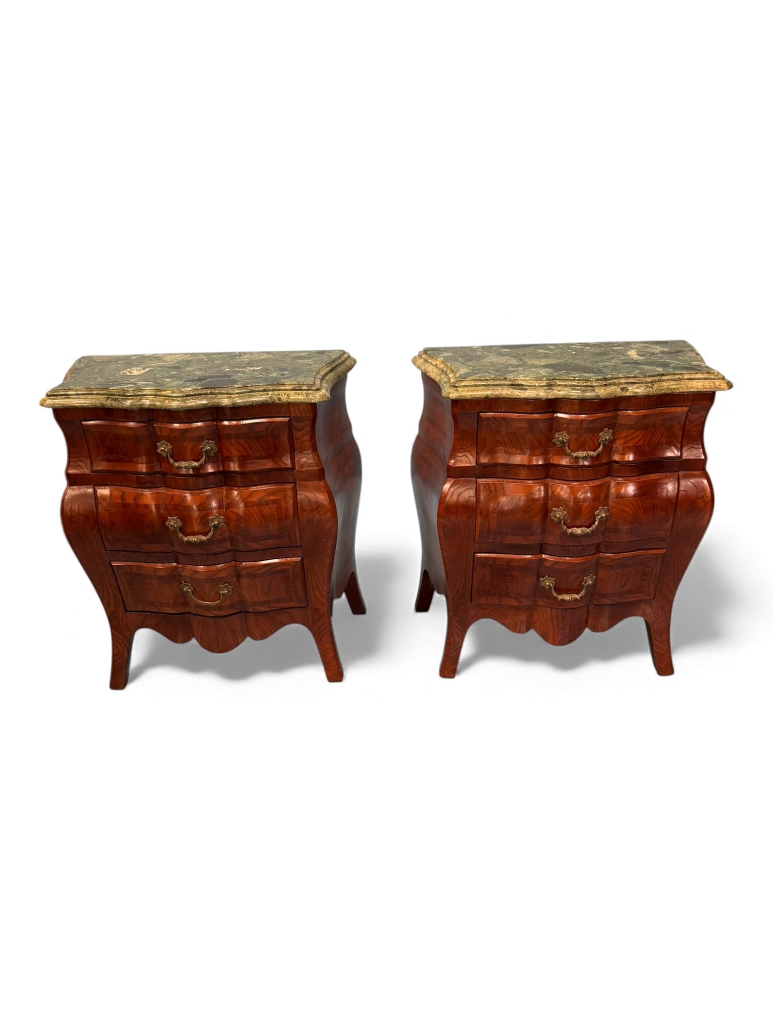 Pair of Louis XV Style Kingwood and Marble-Top Bedside Chests (Commodes), 20th Century: A handsome matched pair of Louis XV–style bedside chests, each constructed in kingwood veneer with finely contoured bombe forms. Each commode is fitted with three drawers, all retaining well-figured
