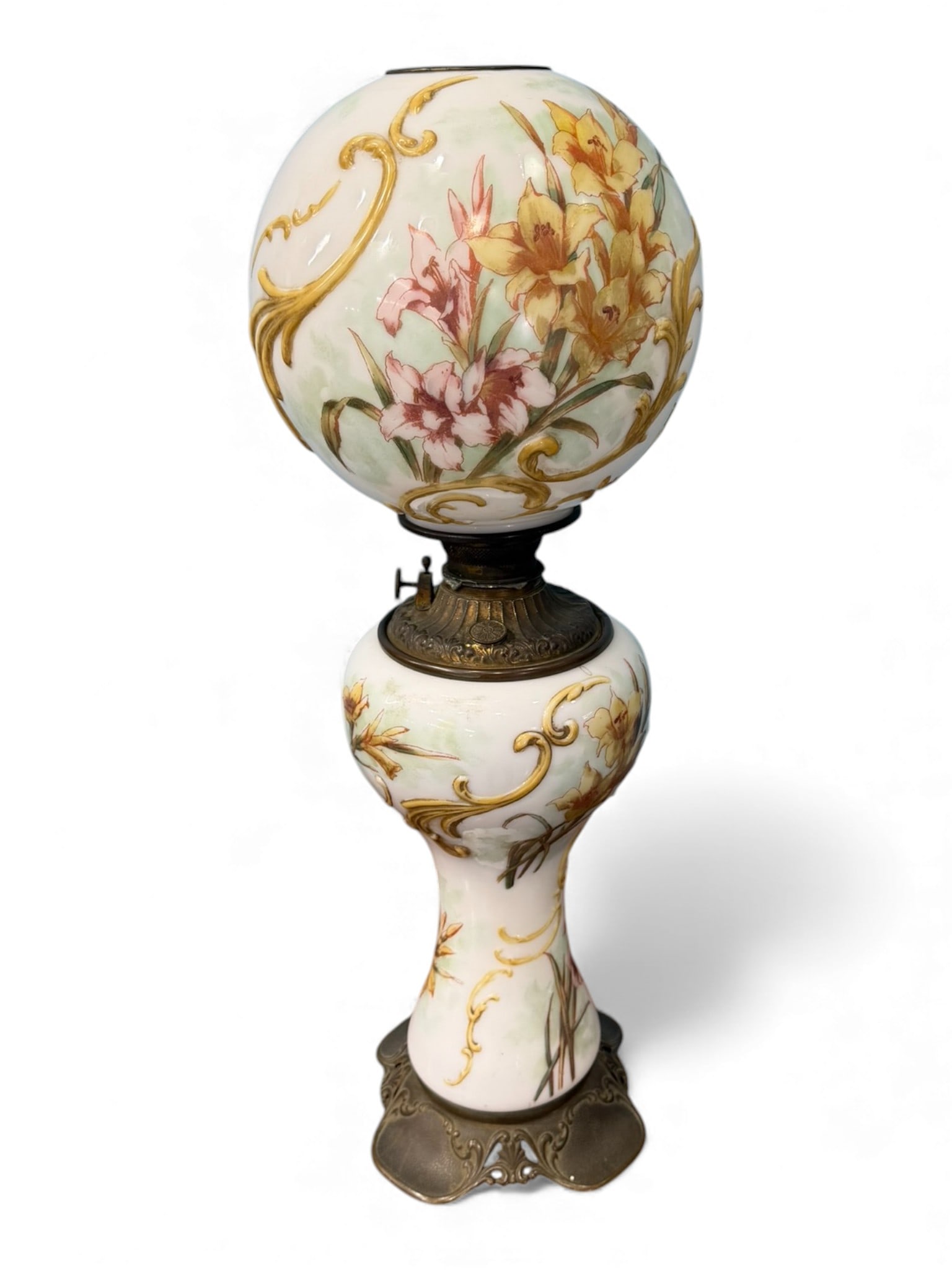 Victorian Hand-Painted Milk Glass Oil Lamp (Not Electrified): Victorian oil lamp retaining its original oil font and burner, not converted to electricity. Hand-painted floral decoration with raised gilt scrollwork on milk glass body, set into a cast metal base.