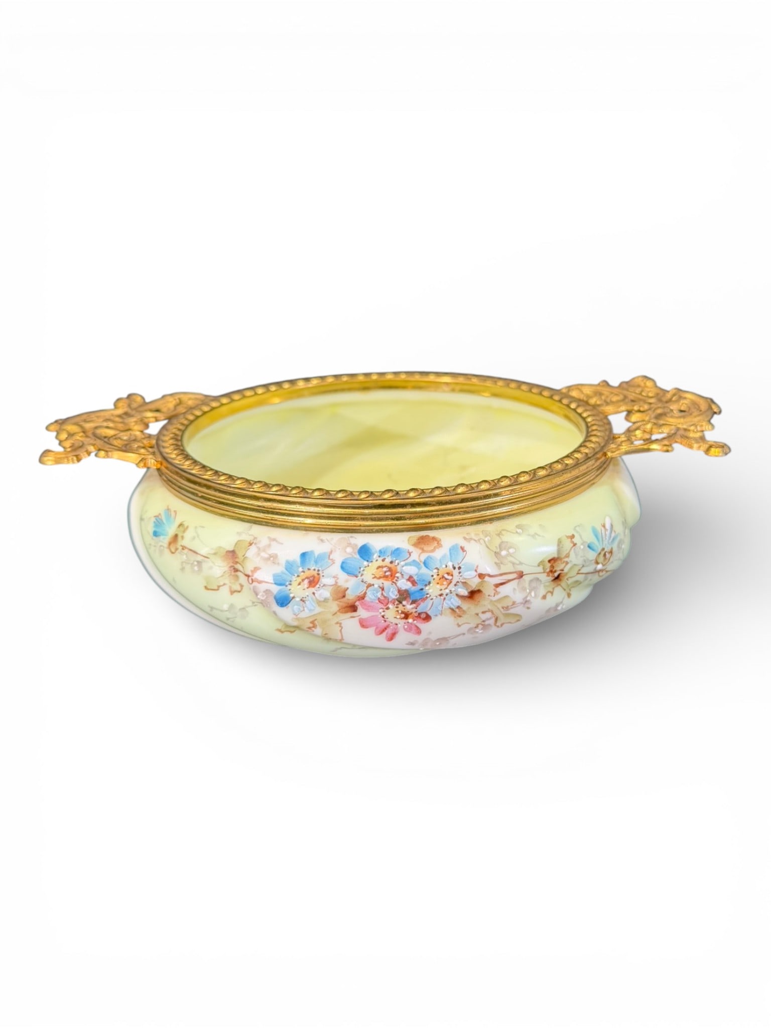 Victorian Wave Crest Glass Bowl with Gilt Brass Mounts, C.F. Monroe Co., Meriden, Connecticut: A fine Victorian Wave Crest art glass bowl featuring a pale custard satin ground with hand-painted floral decoration in soft blue, pink, and gilt highlights. The bowl is mounted with an ornate gilt
