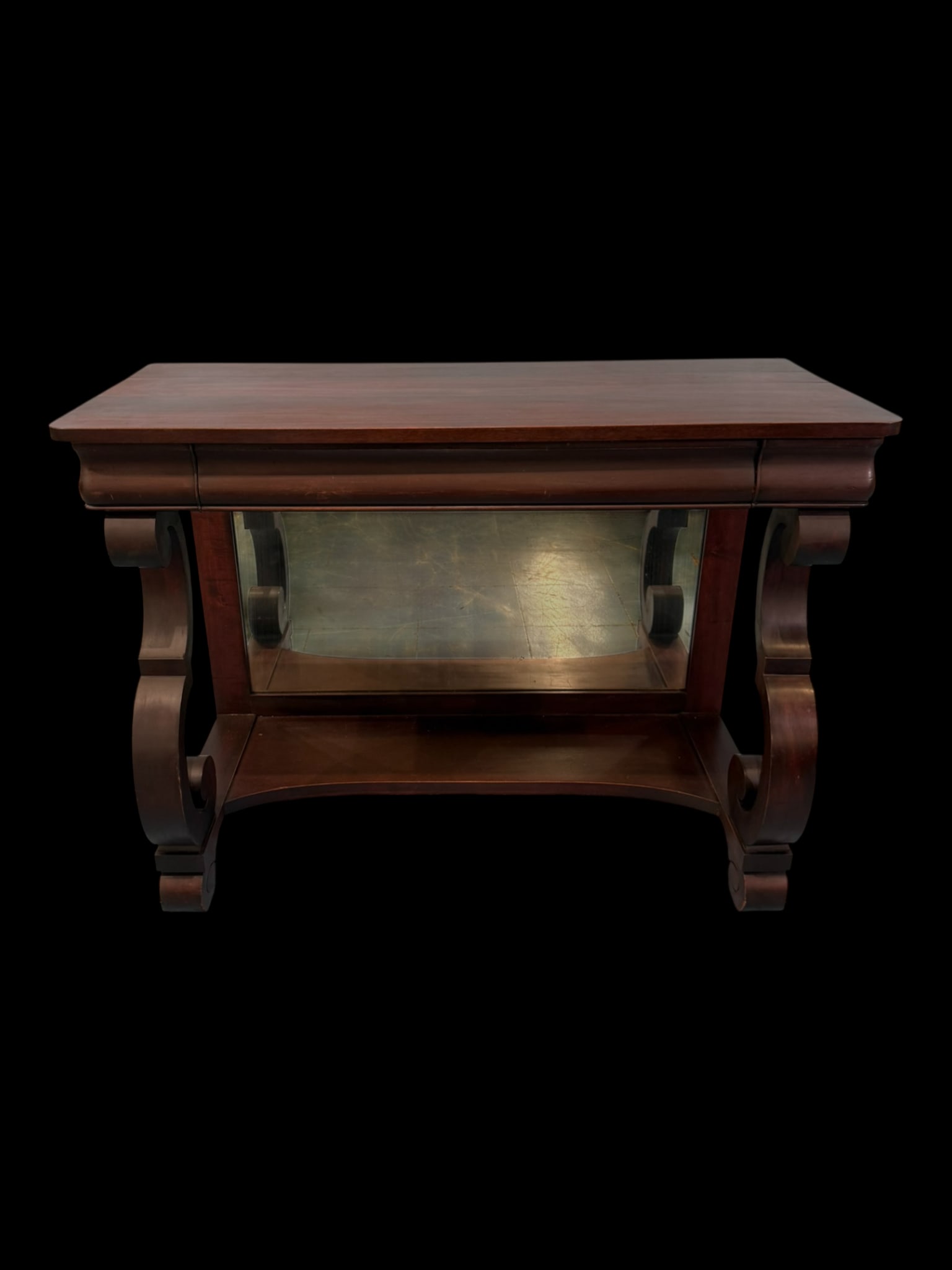 Classical Empire Pier Table: A finely proportioned 19th-century Empire pier table crafted in dark-stained hardwood, featuring a rectangular top with molded edge above a frieze fitted with a single central drawer. The table is