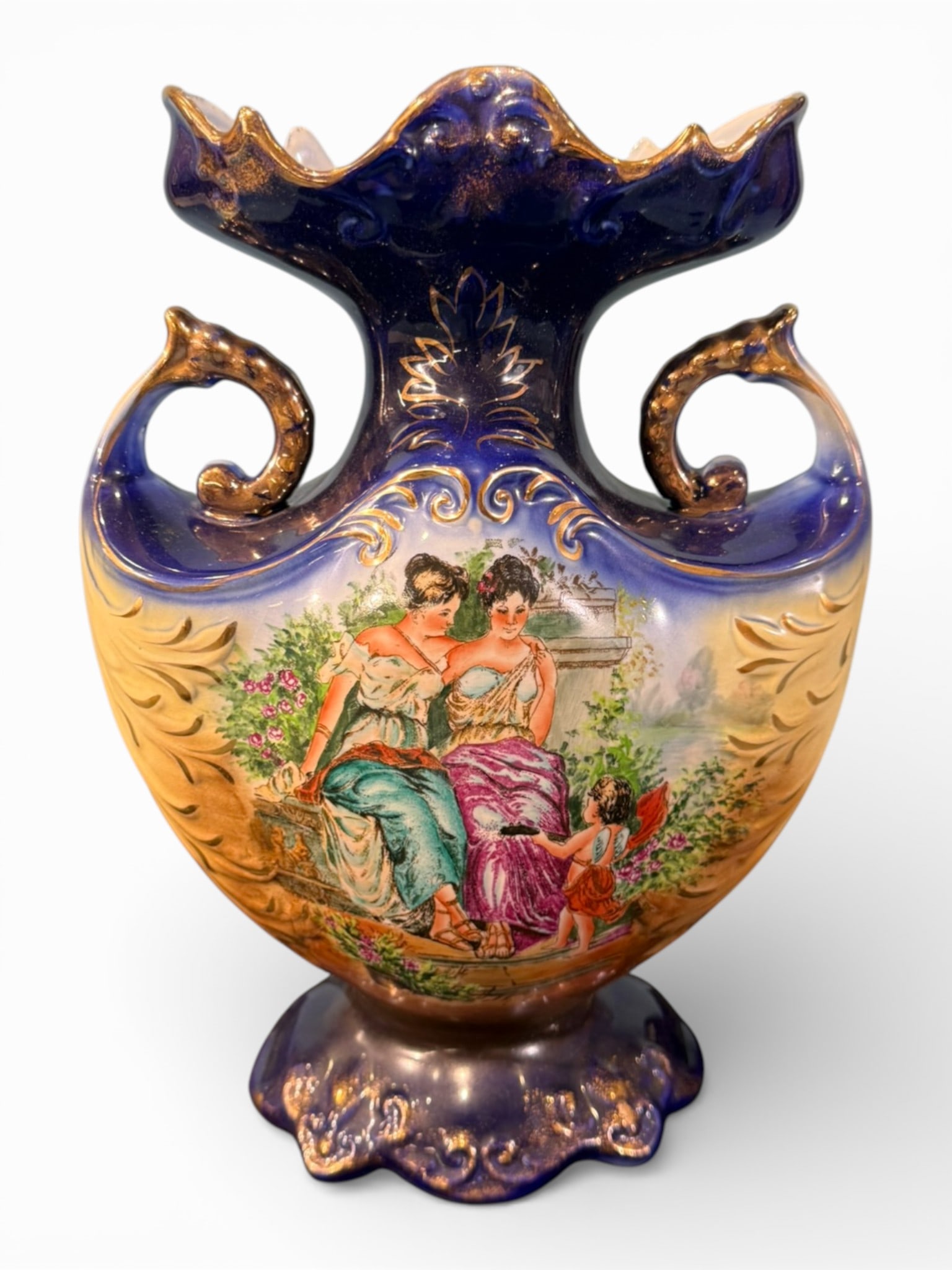 Royal Victoria Ware Ironstone Scenic Two-Handled Vase: An English Royal Victoria Ware ironstone vase of impressive scale and vivid coloration, featuring a rich cobalt blue ground with gilt highlights and molded scrollwork. The bulbous body rises to a