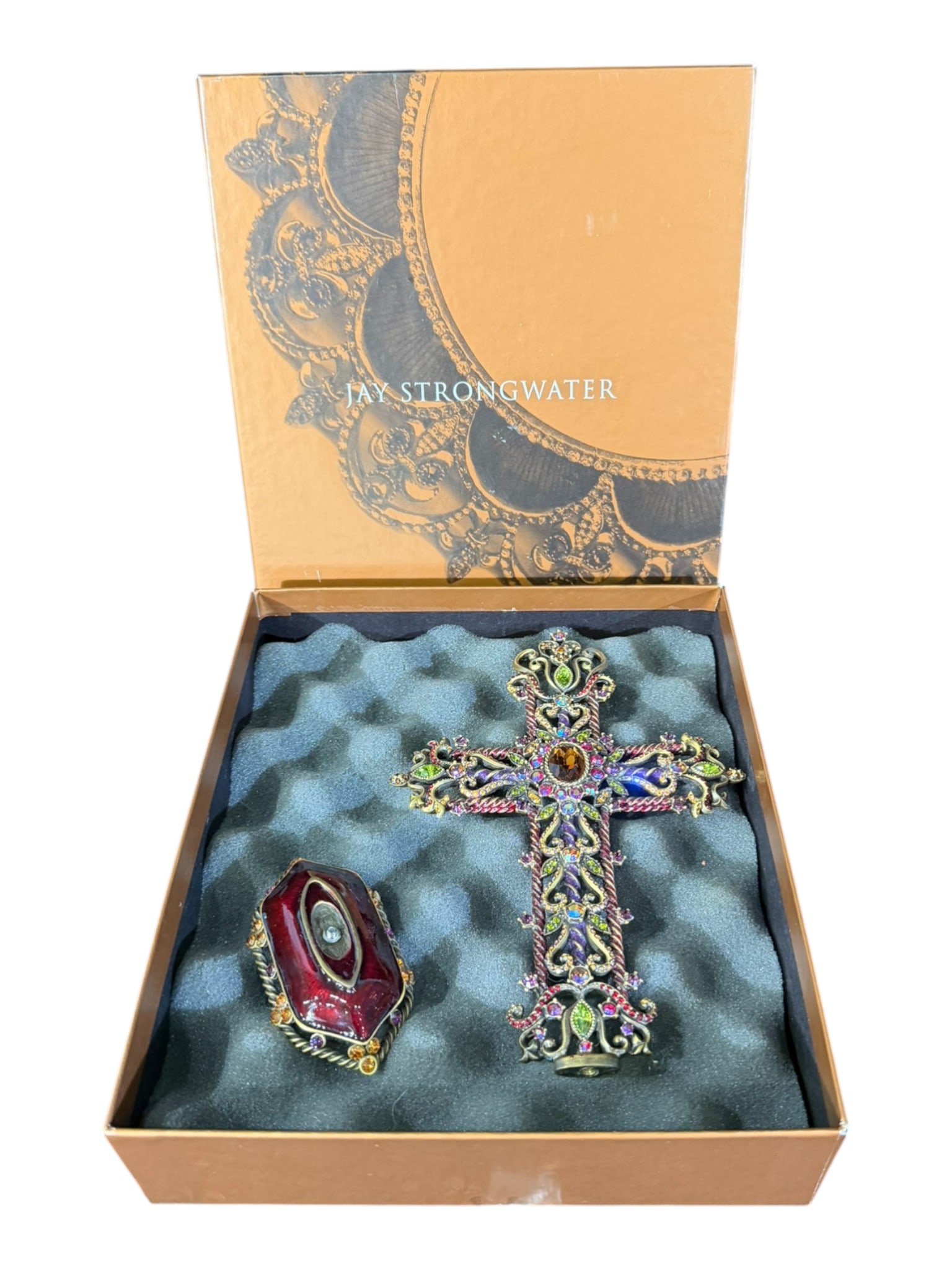 Jay Strongwater Jeweled Cross on Stand with Box: A striking Jay Strongwater decorative cross on stand (seperated), richly embellished with multicolored jeweled accents and ornate scrolling metalwork in the designer’s signature style. The cross is