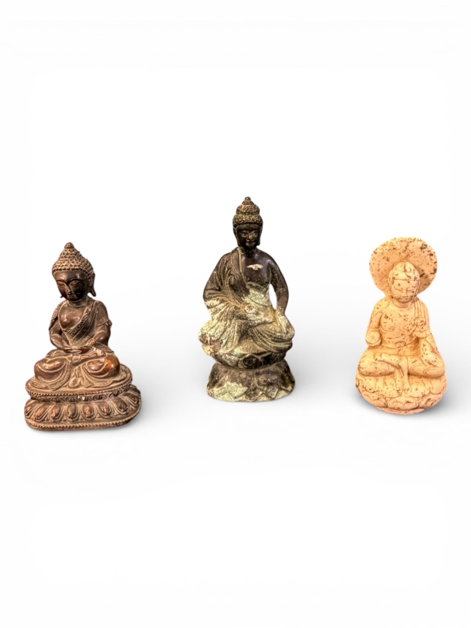 Group of Three Asian Buddha Figures (Bronze, Cast Metal, Marble): Grouping of three Asian Buddha figures including one bronze example with detailed lotus-form base and crisp robe decoration, one cast metal figure with natural verdigris patination seated in