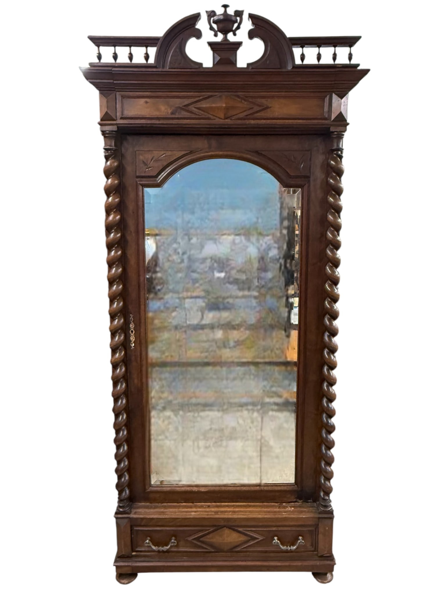 Large Barley Twist Armoire / Wardrobe, Part of Three-Piece Bedroom Suite (See Lots 112 & 113): Impressive late 19th to early 20th century barley twist wardrobe crafted in richly grained hardwood, featuring boldly turned spiral columns flanking a full-length mirrored door. The architectural crow