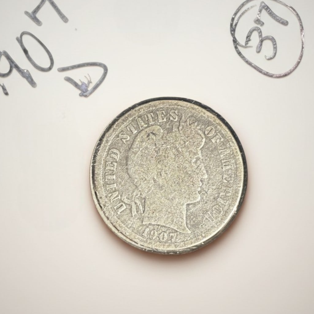 1903 Liberty Head "V" Nickel: United States five-cent piece dated 1903, Liberty Head (V Nickel) design by Charles E. Barber. Obverse features Liberty facing left wearing a coronet inscribed LIBERTY and encircled by thirteen