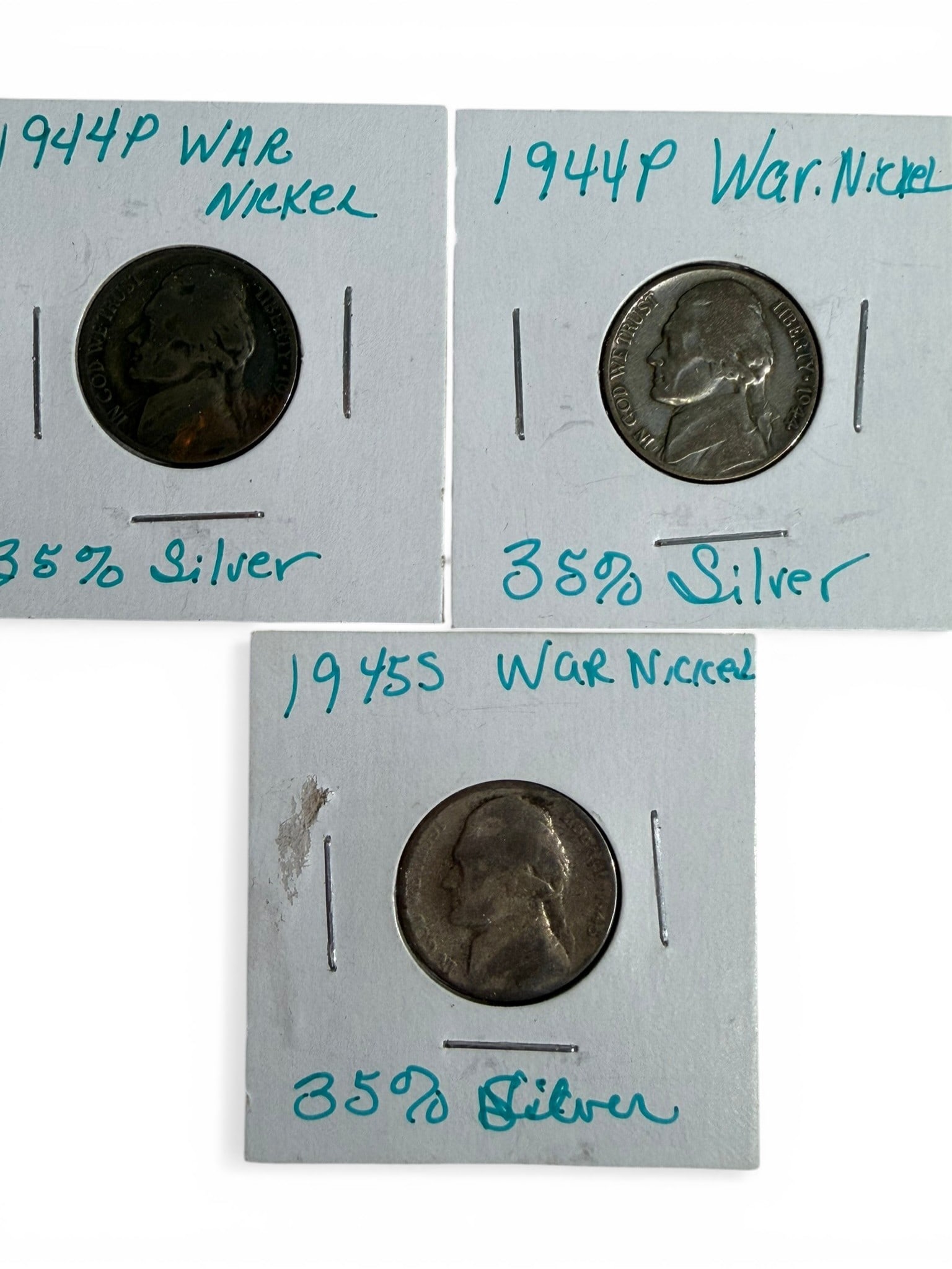 World & U.S. Nickel Group Including 1944-1945 Silver "War Nickels" (3 Coins): Group of three Jefferson nickels including two 1944-P examples and one 1945-S War Nickel, all struck in the wartime 35% silver alloy composition, along with two additional earlier Jefferson nickels. T