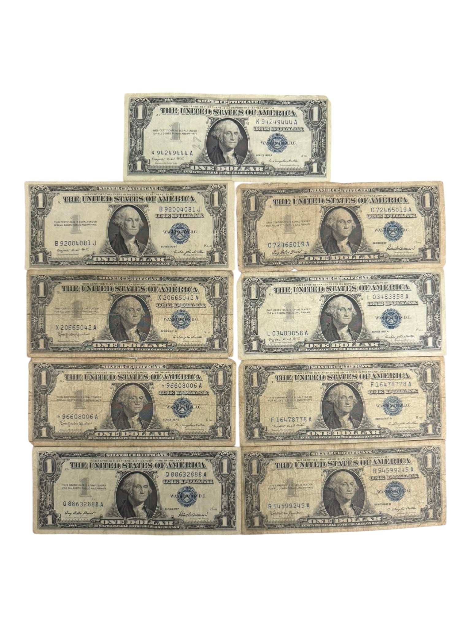 Group of Ten (10) United States Silver Certificates, $1 Notes (1935 & 1957 Series): Collection of ten United States $1 Silver Certificates, primarily from the 1957 and 1957B series with at least one earlier 1935 issue present. These classic blue-seal notes represent the last era of c