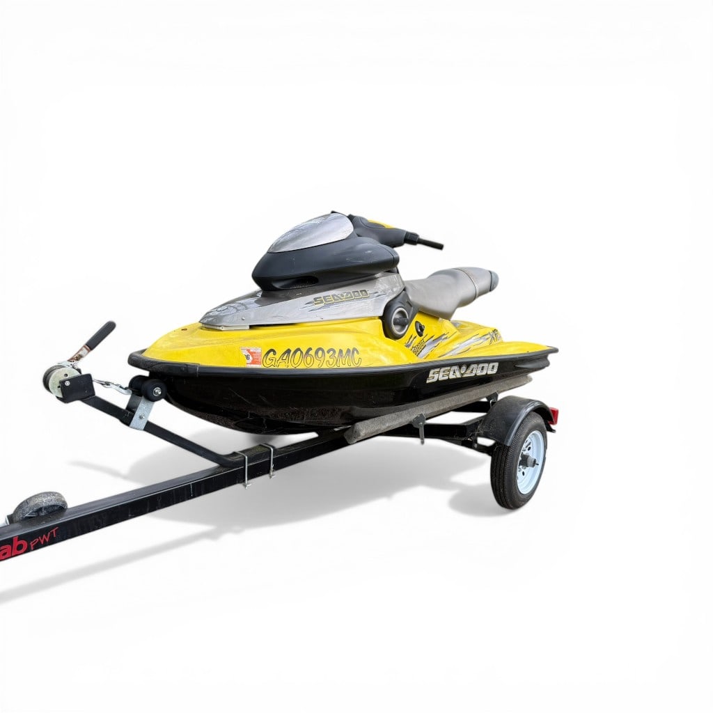 Sea-Doo XP Limited Personal Watercraft with Trailer: Sea-Doo XP Limited personal watercraft powered by Rotax Marine engine, finished in yellow and black livery and mounted on a single-axle trailer. Hull marked with registration GA0693MC. Includes