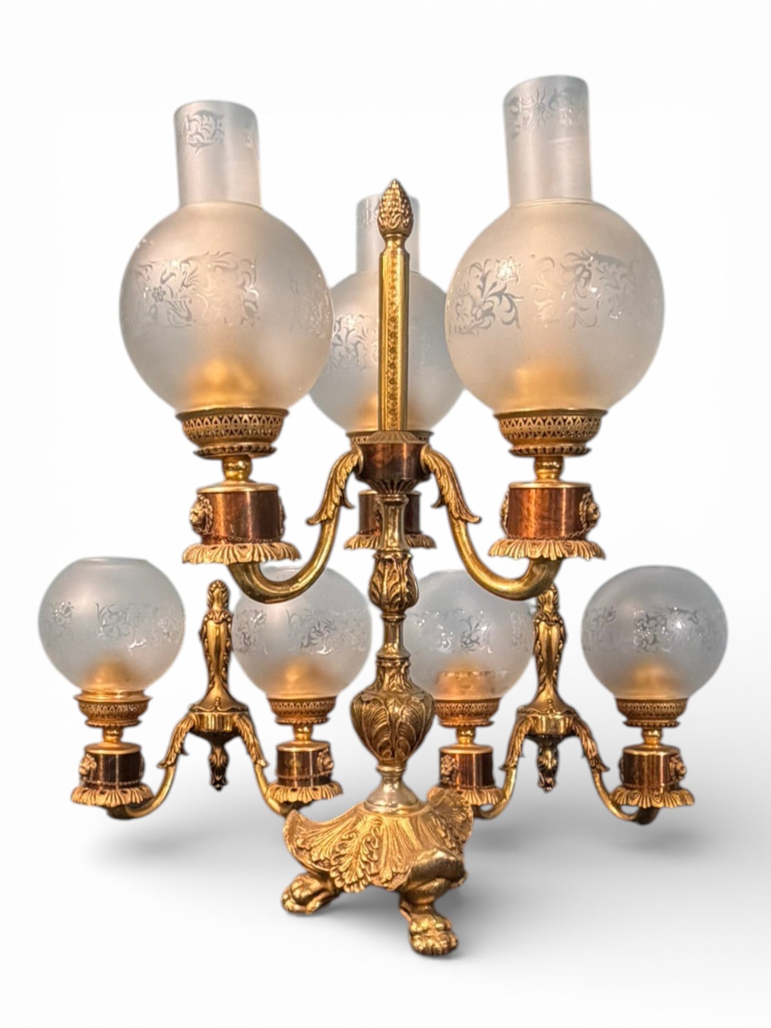 French Louis XVI Style Gilt Metal Three-Light Bouillotte Lamp with Double-Arm Sconces: French Louis XVI Style Gilt Metal Three-Light Bouillotte Lamp with En Suite Pair of Double-Arm Wall Sconces, mid-20th century, each with scrolling arms, lion mask mounts, and acanthus-cast elements,
