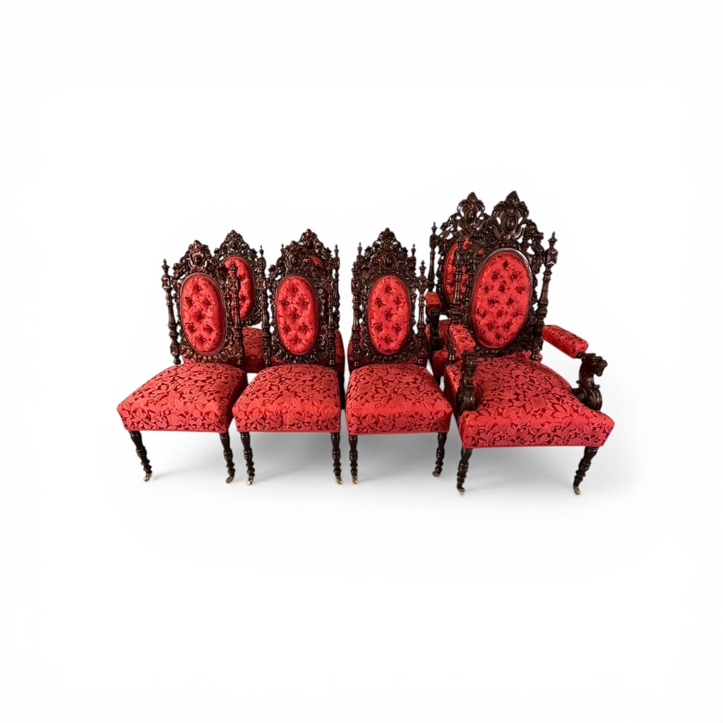 Alexander Roux Carved Rococo Revival Dining Chairs (Set of Eight): An exceptional and highly important set of eight carved dining chairs by Alexander Roux, New York, comprising six side chairs and two armchairs, executed in richly figured dark mahogany and embodying