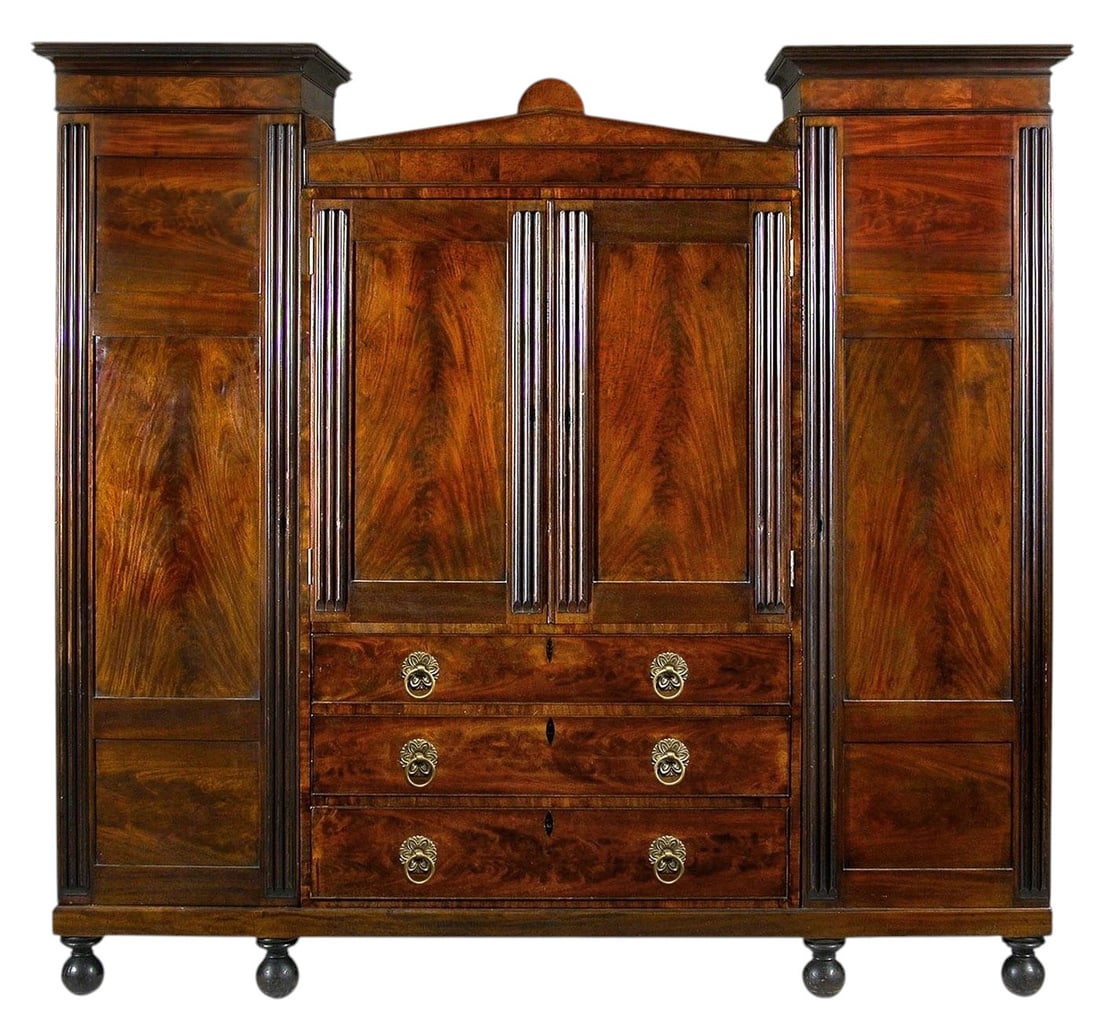 Important Baltimore Classical Carved Reeded Mahogany Winged Wardrobe, Attr. to the Workshop of John: An important and architecturally imposing Baltimore Classical mahogany winged wardrobe, attributed to the workshop of John Needles (1786–1878), and dating to the second quarter of the 19th century.