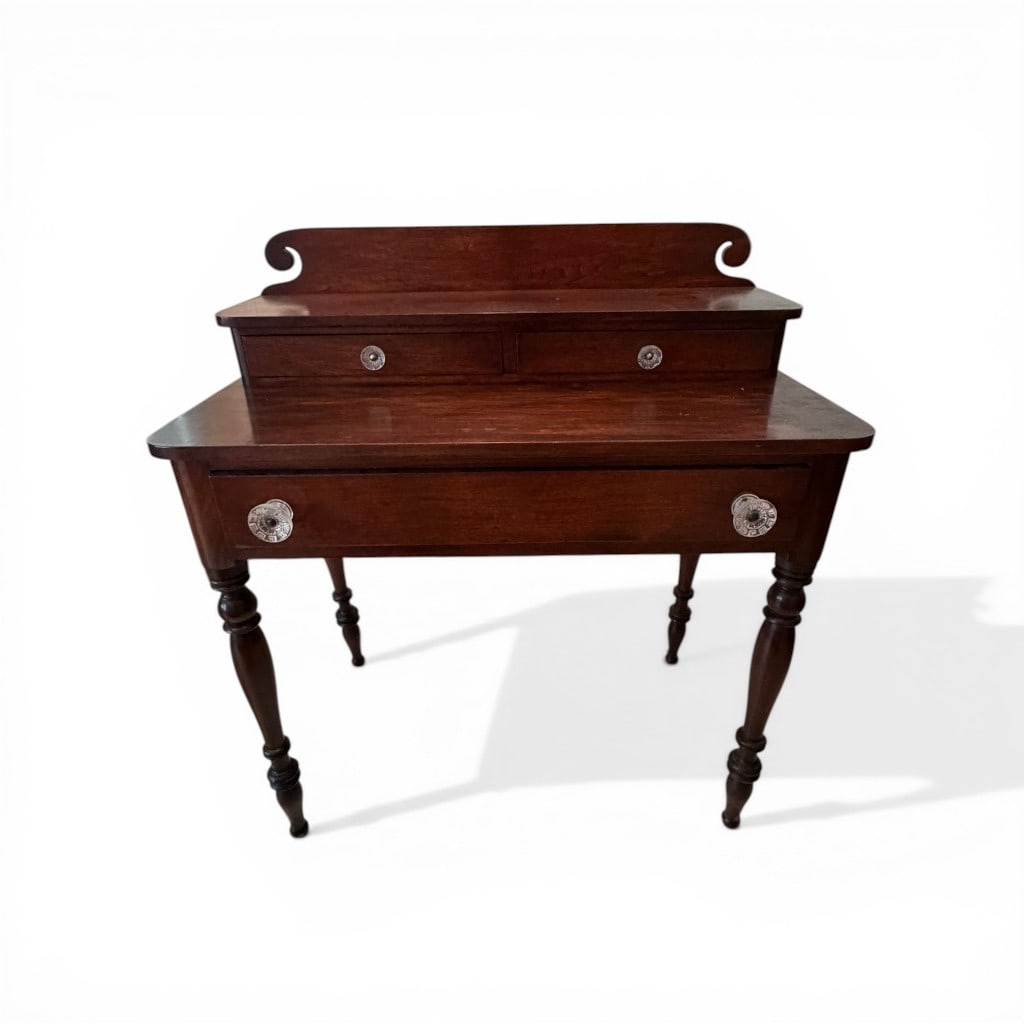 American Mahogany Three-Drawer Server, Southern, mid-19th century: A well-proportioned American mahogany server, Southern in origin and likely made in Virginia or North Carolina, featuring a shaped gallery back with distinctive scrolled ends above a two-drawer upper