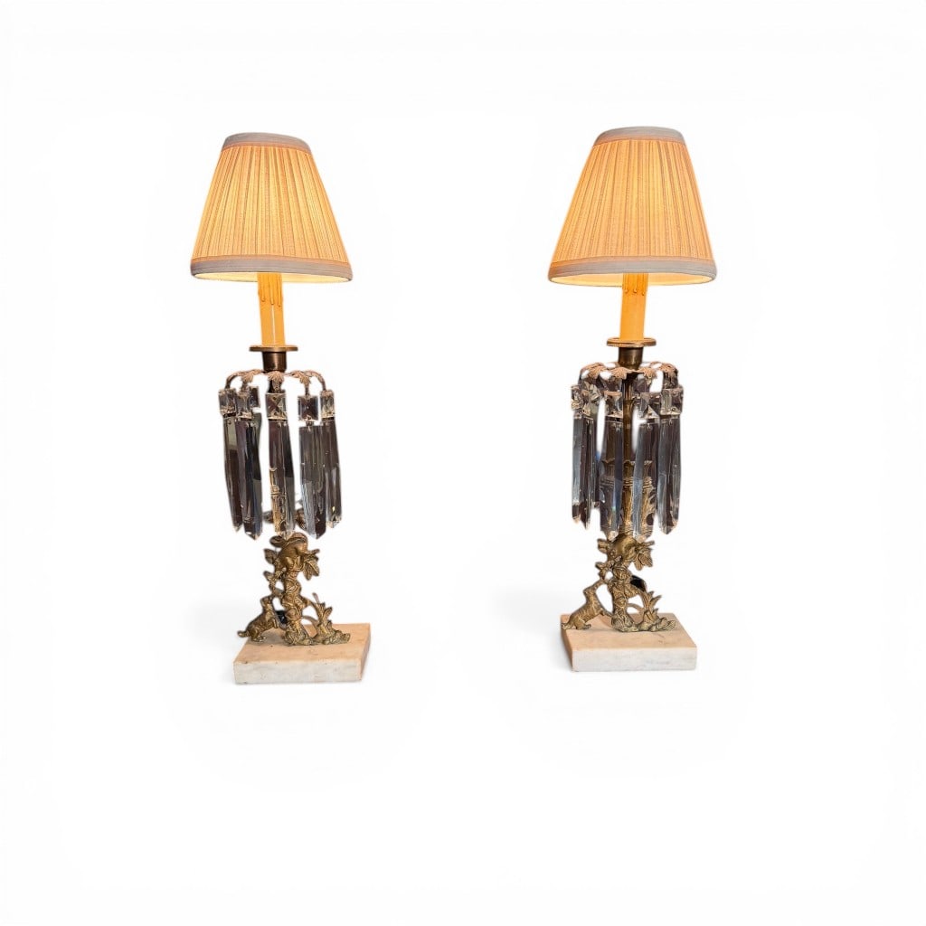 Pair of Figural Girandole Table Lamps with Prisms: A pair of figural girandole table lamps, each featuring a cast metal base depicting a naturalistic woodland scene with a dog at play beneath a flowering vine, accented by a perched squirrel above.The