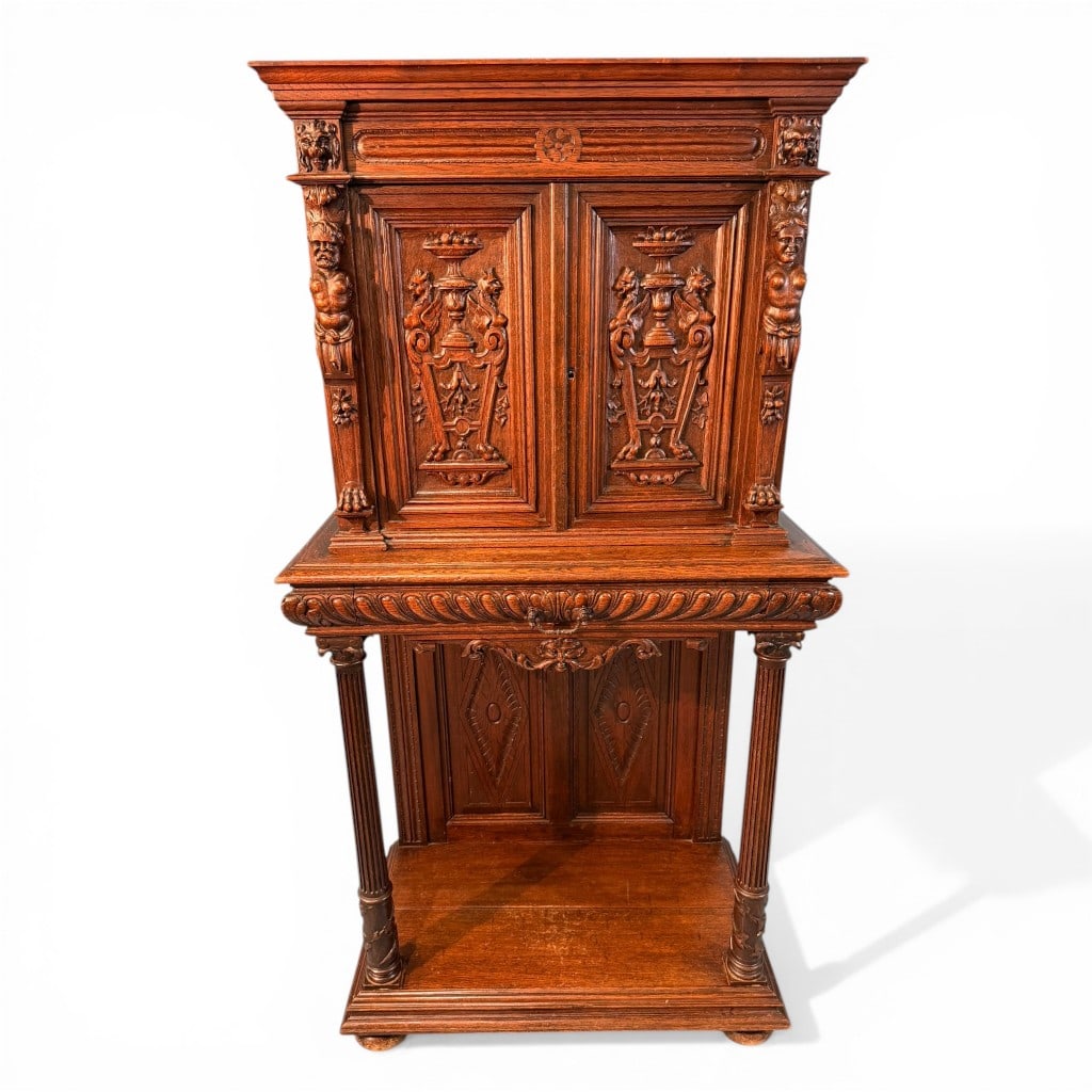 French Renaissance Revival Carved Console with Cabinet Top, Norman, Paris: A finely executed French Renaissance Revival carved oak console with integral cabinet top, bearing a stamped mark to the reverse reading “Norman, Paris.” The upper case fitted with paneled