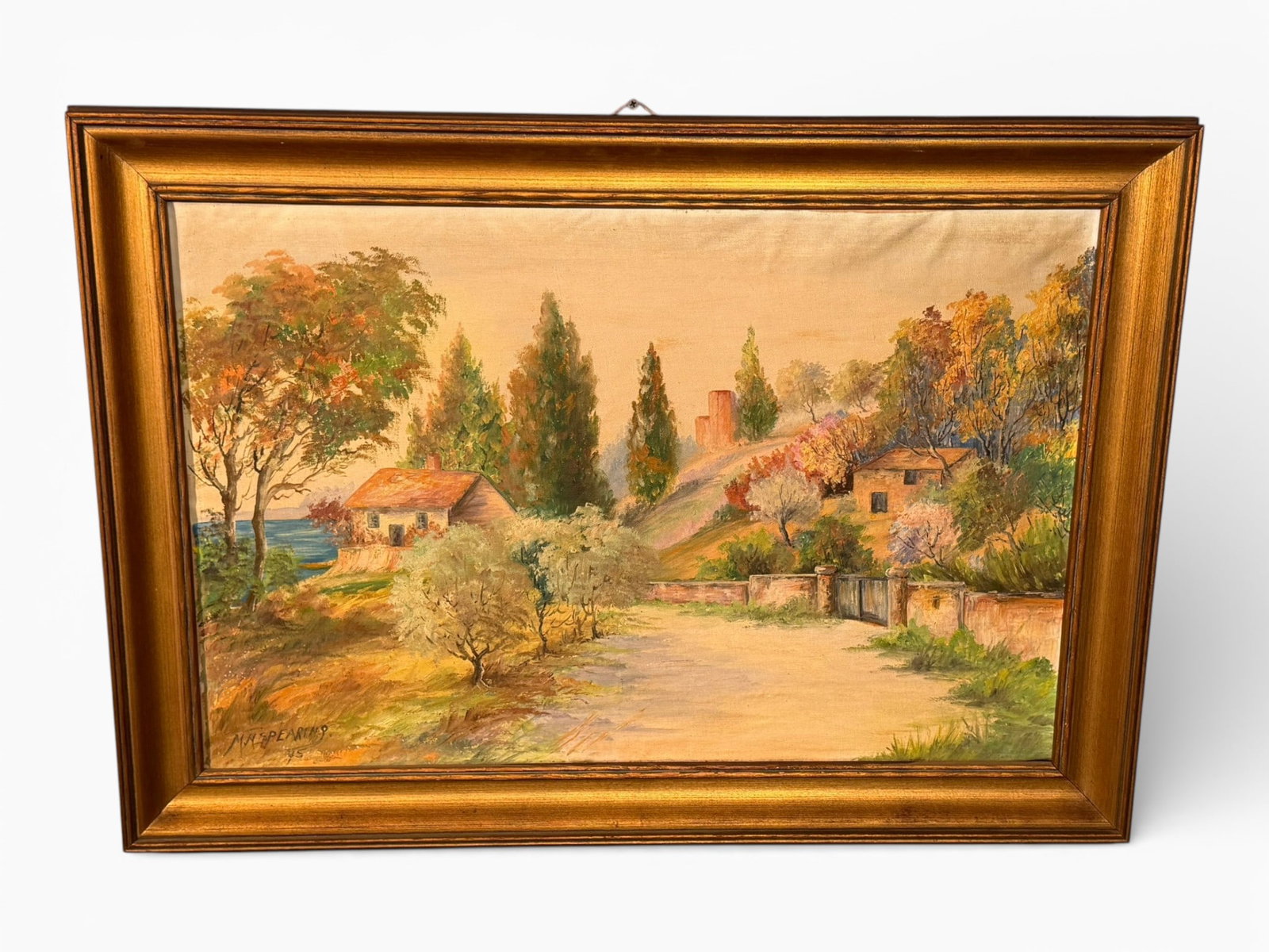 American School Oil on Canvas Landscape, signed Spearing: Oil on canvas depicting a sunlit rural landscape with cottages, trees, and distant water, rendered in a warm palette with loose, expressive brushwork. Signed lower left “M.M. Spearing” and dat