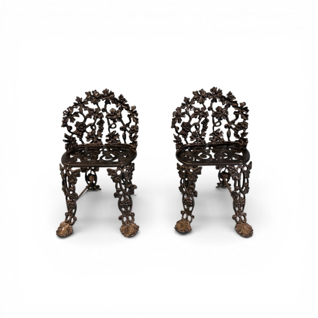 Pair of Victorian Cast Iron Garden Seats with Grapevine Motif: Pair of Victorian cast iron garden seats featuring richly detailed grapevine and foliate decoration throughout. The pierced backs are formed with intertwining vines, leaves, and clusters of grapes,