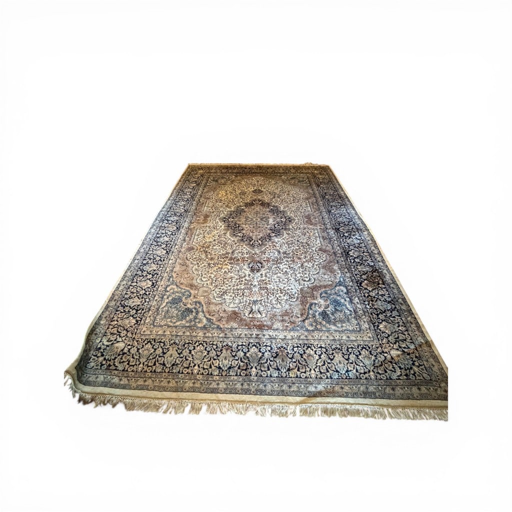 Large Persian-Style Medallion Carpet: A substantial room-size carpet in the Persian taste, featuring a finely detailed central medallion surrounded by dense floral arabesques on an ivory and soft taupe field, enclosed by a deep navy