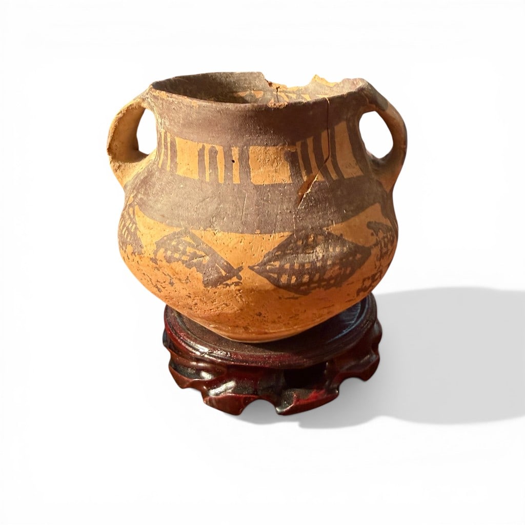 Chinese Neolithic Painted Pottery Jar, Yangshao Culture (Majiayao Type): An ancient Chinese Neolithic painted pottery jar of globular form with short neck and opposing lug handles, decorated in mineral pigment with bold geometric and abstract motifs characteristic of the