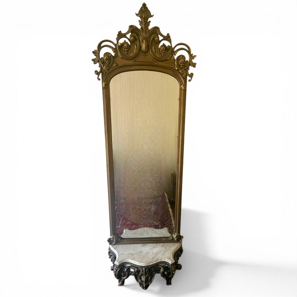 Victorian Giltwood Pier Mirror with Marble Console Base, Two-Piece: An impressive Victorian pier mirror in elaborately carved and gilt-decorated wood, presented in two parts comprising the tall mirror and matching marble-top console base. The frame is richly adorned w