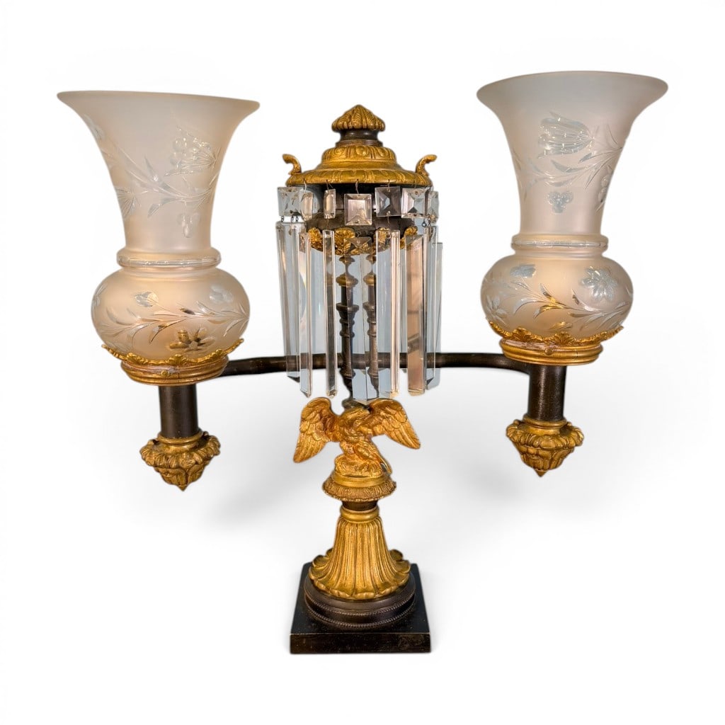 American Federal Double-Arm Argand Lamp with Eagle, c. 1820-1830: An American Federal double-arm Argand table lamp, circa 1820-1830, in gilt and patinated metal, the central standard mounted with a finely cast spread-wing eagle above a fluted column and square