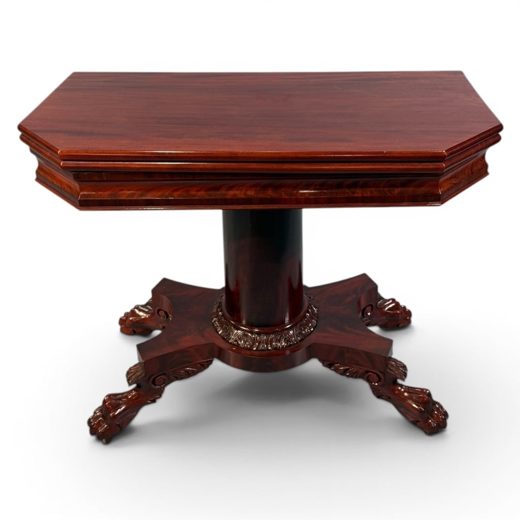 New York Classical Mahogany Fold-Over Card Table, ca. 1825-1840: A fine American Classical mahogany fold-over card table, likely New York, second quarter 19th century, having a rectangular hinged top with clipped front corners opening to a square playing surface.