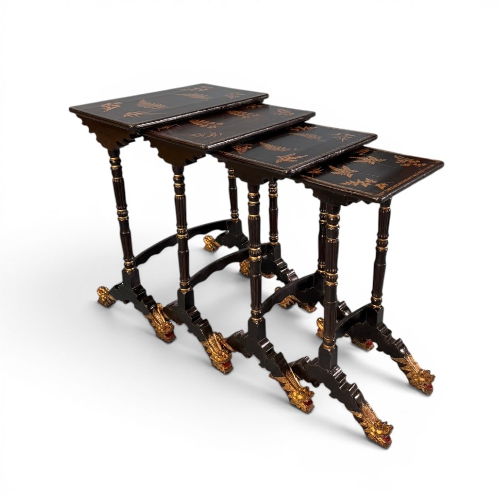 Set of Four Aesthetic Movement Ebonized and Gilt Nesting Tables, Raynal C. Bolling / Greenwich: An exquisite set of four graduated nesting tables, late 19th to early 20th century, in ebonized finish with gilt highlights and finely decorated tops featuring gilt botanical and fern motifs. Each