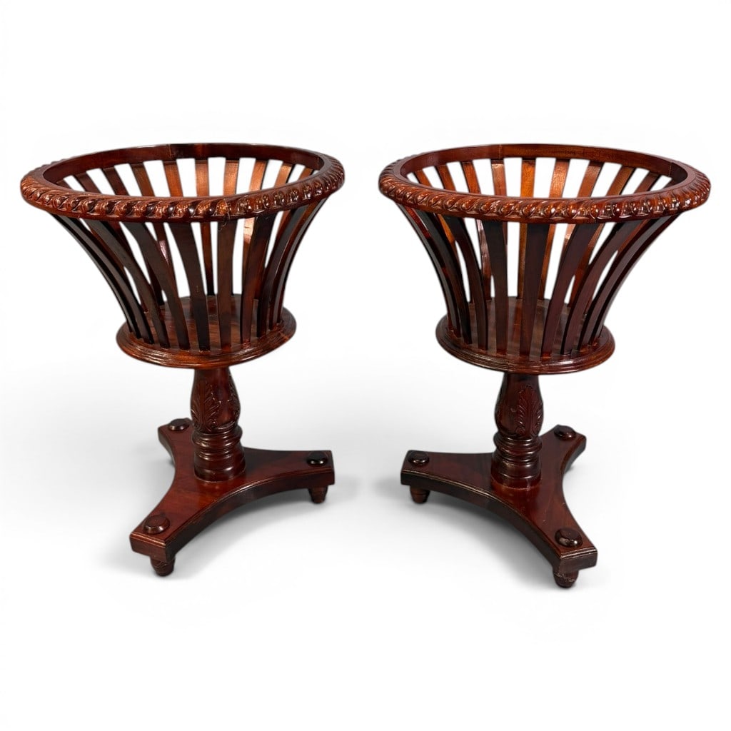 Pair of English Regency-Style Mahogany Jardiniere or Fern Stands: Pair of English Regency-style mahogany jardiniere or fern stands, each with a circular open basket-form gallery composed of vertical flared staves beneath a boldly carved gadrooned rim, raised on a