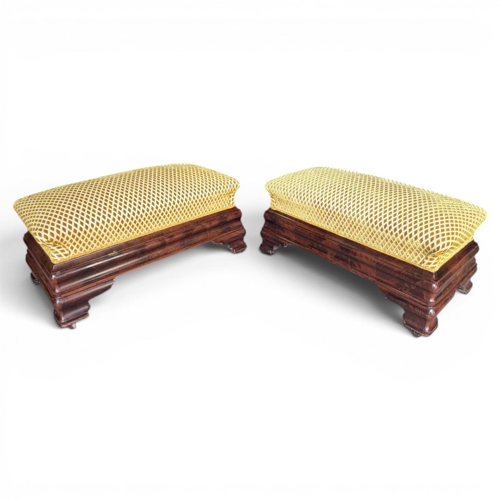 Pair of American Empire Mahogany Upholstered Benches, c.1830-1845: Pair of American Empire mahogany upholstered benches, circa 1830-1845, each having a rectangular upholstered cushion over a richly figured mahogany base with bold molded plinth sides, stepped block fe