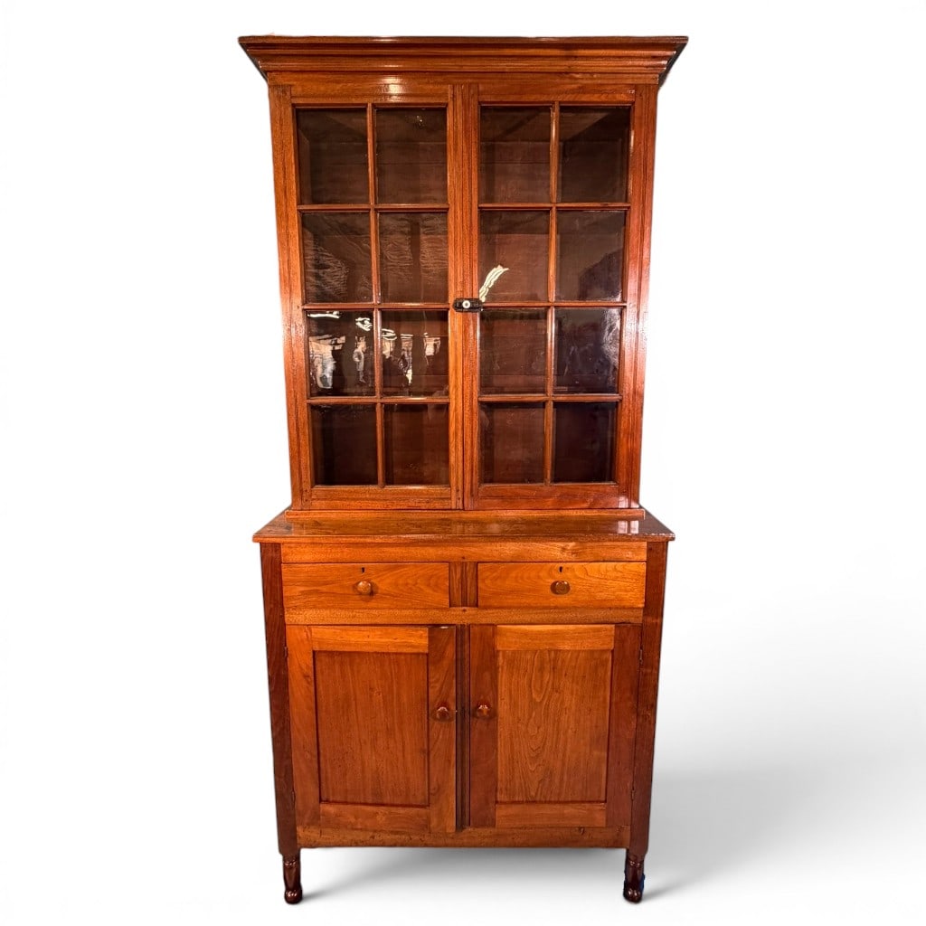 Southern Sheraton Cherry Step-Back Cupboard / Jackson Press: Southern Sheraton cherry step-back cupboard, often called a Jackson press in the Southern market, circa 1820?1840, in two-part form with an upper glazed bookcase/cupboard section over a lower case fit