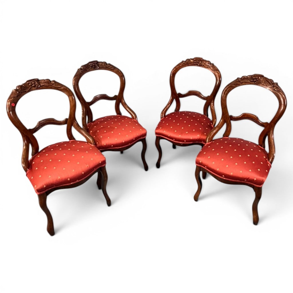 Set of Four Victorian Balloon-Back Side Chairs: A set of four Victorian walnut balloon-back side chairs, circa 1870?1890, each with a shaped open back, carved crest rail with floral and foliate decoration, serpentine lower splat, molded stiles,