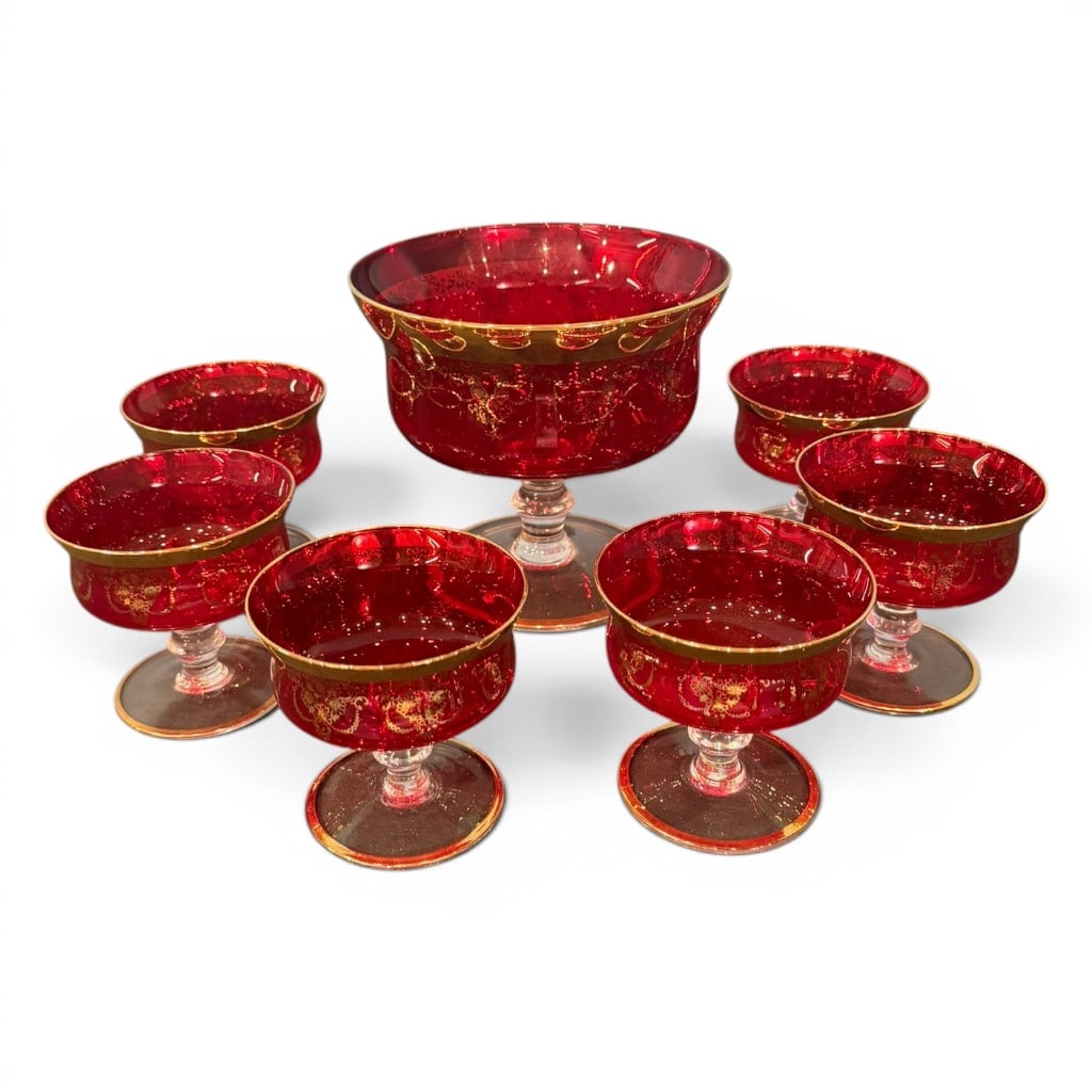 Seven-Piece Ruby Red and Gilt Glass Dessert Set, Bohemian/Victorian, Late 19th C.: Seven-piece ruby red glass dessert or sherbet set, probably Bohemian, late 19th century, comprising one large compote and six matching stemmed sherbet cups. Each piece features deep ruby glass bowls