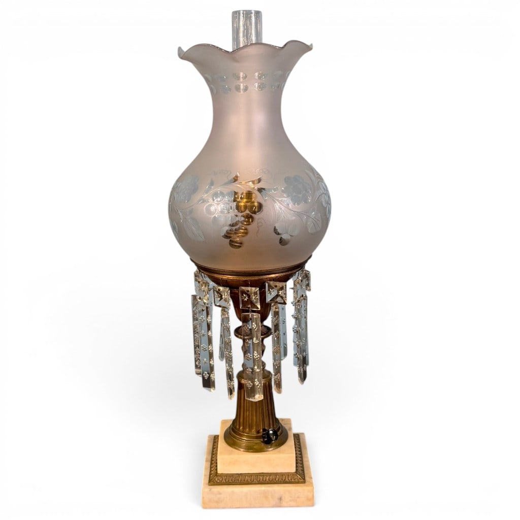 Victorian Brass and Marble Astral Lamp with Prisms: Victorian brass astral lamp, electrified, having frosted and etched glass globe shade with grape and vine decoration, clear glass chimney, cut crystal prism drops, reeded brass standard, and square
