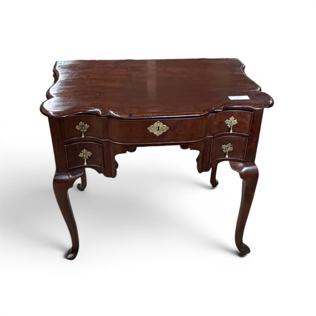 Pennsylvania Chippendale Lowboy Dressing Table: Pennsylvania Chippendale mahogany lowboy or dressing table, the molded serpentine-front top above a shaped case fitted with one long drawer flanked by two short drawers on each side, retaining