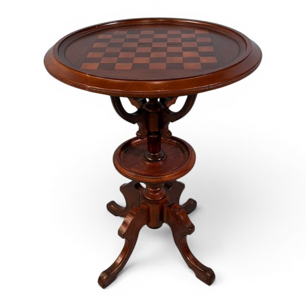 American Parlor Games Table with Inlaid Chessboard Top, Late 19th C.: American parlor games table, late 19th century, in walnut or mixed hardwood with warm reddish-brown finish, having a circular molded top centered by an inlaid checkerboard/chessboard playing surface