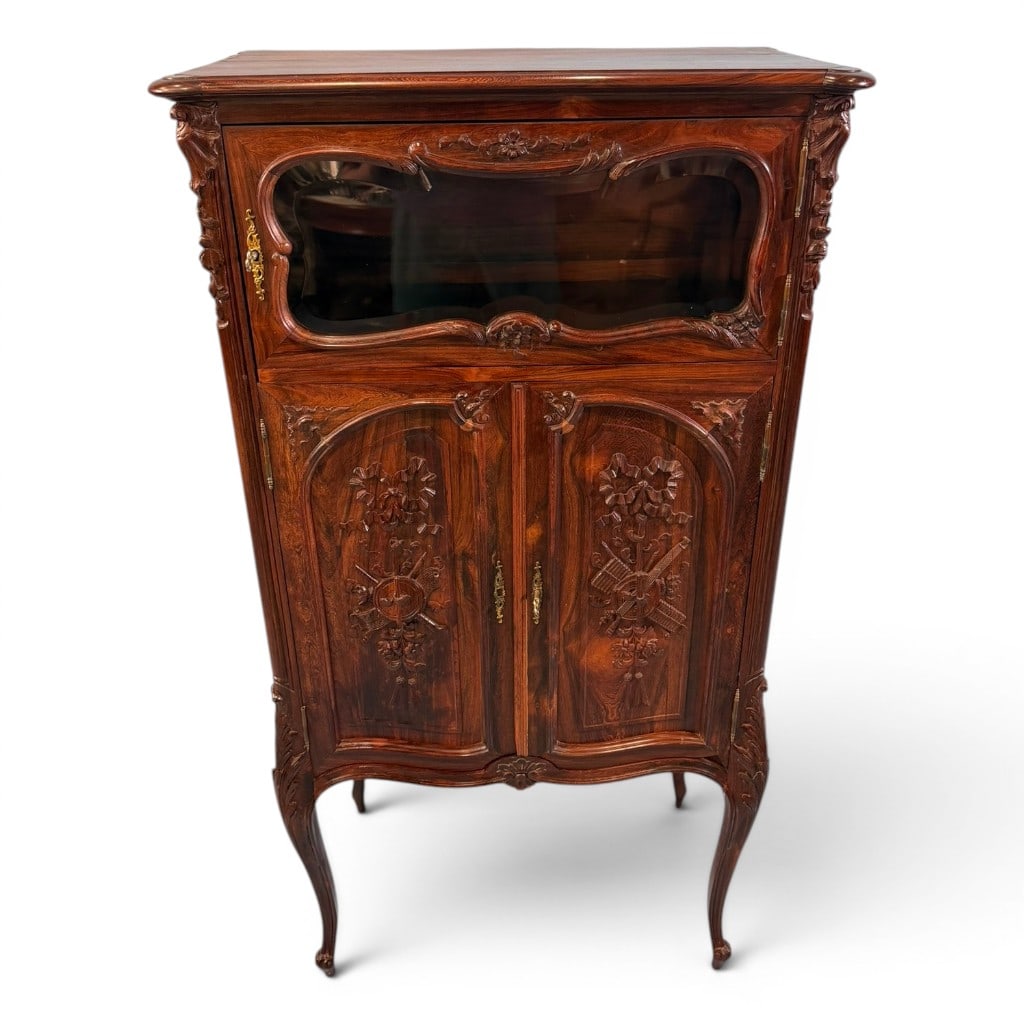 French Louis XV Style Rosewood Music Cabinet / Vitrine: French Louis XV style rosewood music cabinet or vitrine, a handsome narrow cabinet with serpentine front, shaped glass upper door, and two carved lower cupboard doors. The case is richly figured in