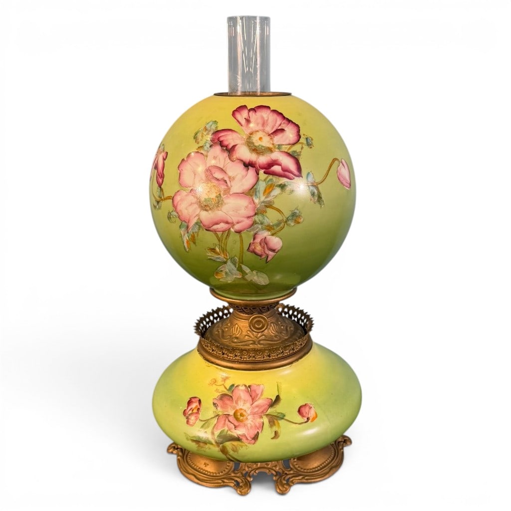 Victorian Painted Floral Gone with the Wind Parlor Lamp: Victorian Gone with the Wind style parlor lamp, late 19th century, having matching yellow-green painted glass globe shade and font/base decorated with pink floral sprays, mounted on an ornate cast