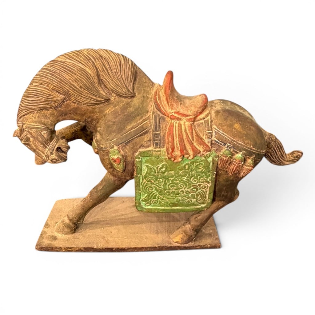 Chinese Ming Dynasty Polychrome Glazed Pottery Figure of a Caparisoned Horse, 16th/17th Century: Chinese polychrome glazed pottery figure of a caparisoned horse, Ming dynasty or later, modeled standing on a rectangular plinth with lowered head, arched neck, striated mane, saddle, red saddle